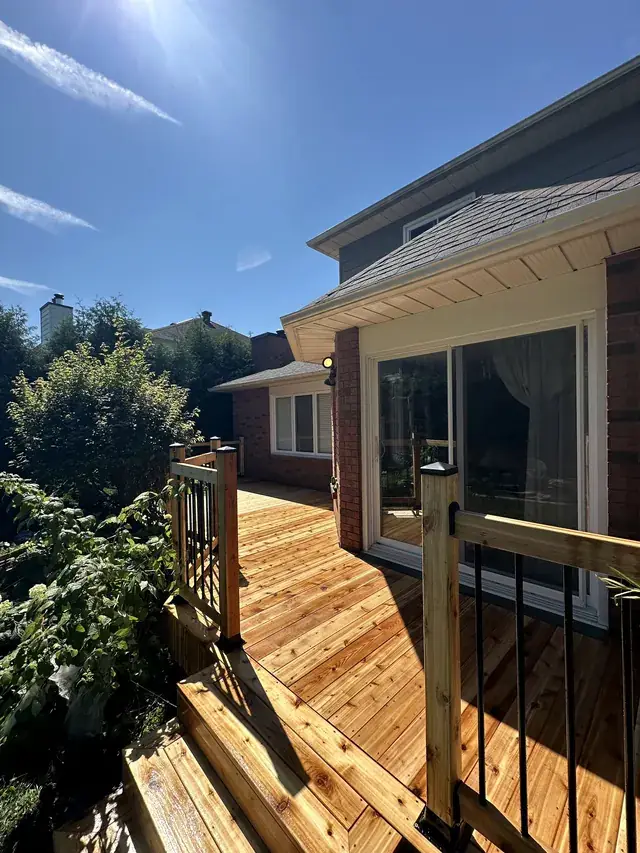New cedar deck with black railings