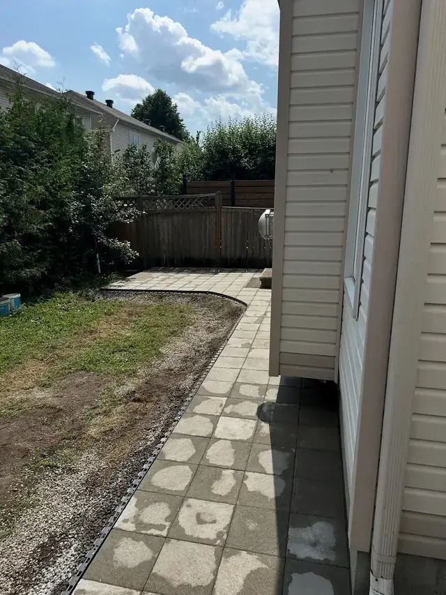 Slab walkway along a house